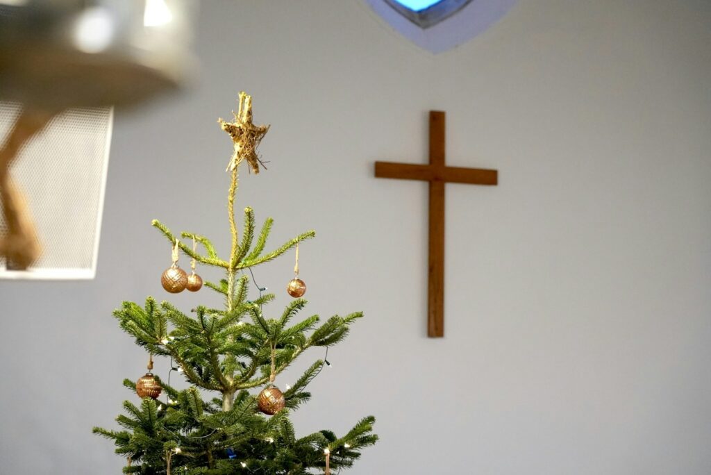 Christmas tree and cross, holiday season.