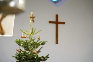 Christmas tree and cross, holiday season.